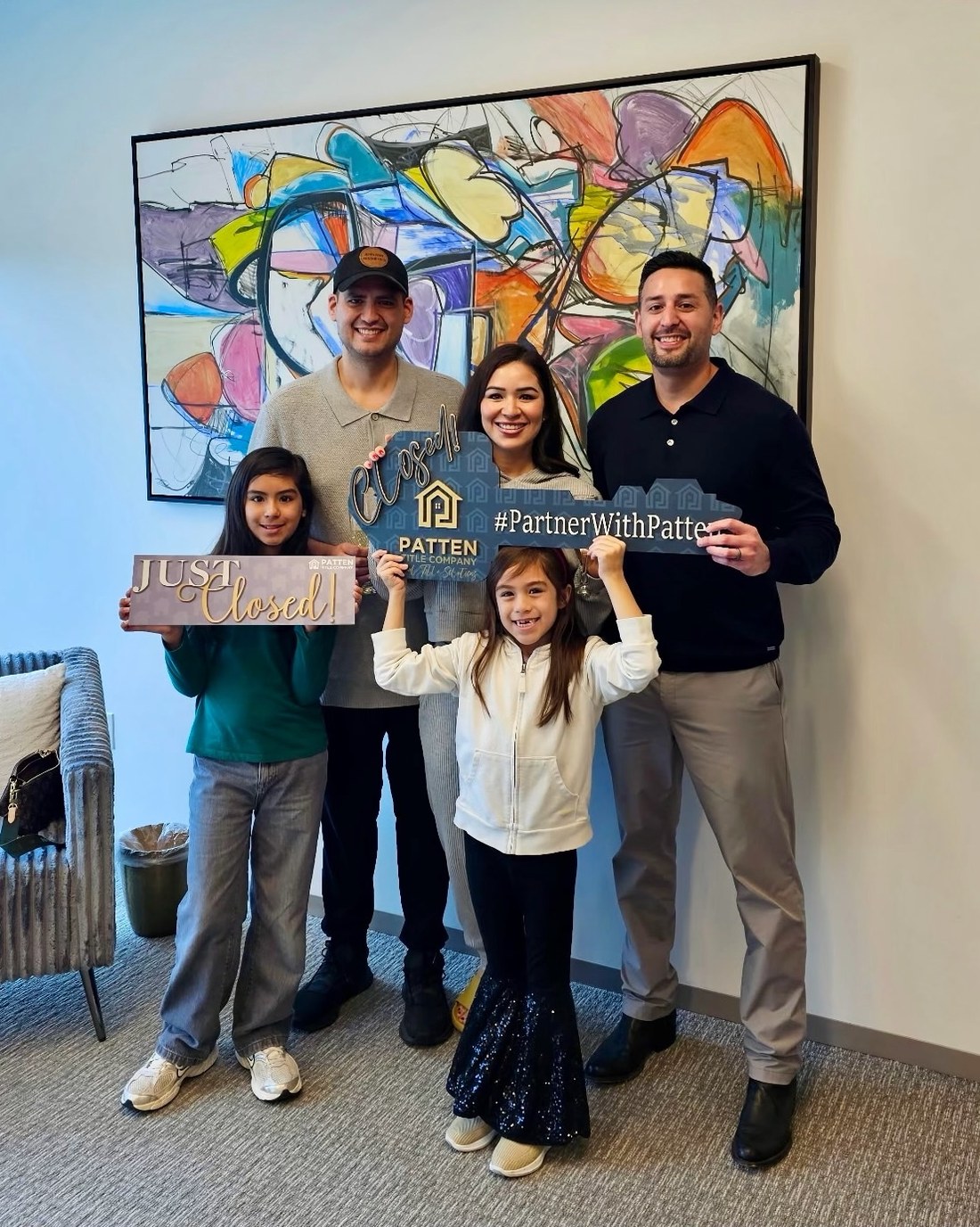 Francisco Martinez with a client family on closing day at Patten Title Company